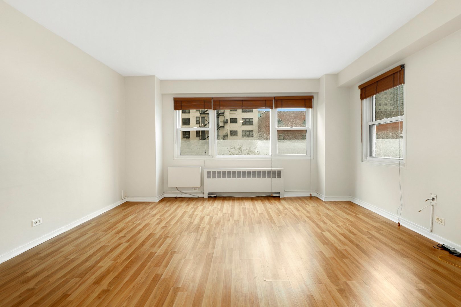 Undisclosed Address Chicago, IL 60657 - Photo 5 of 18 a view of an empty room with a window