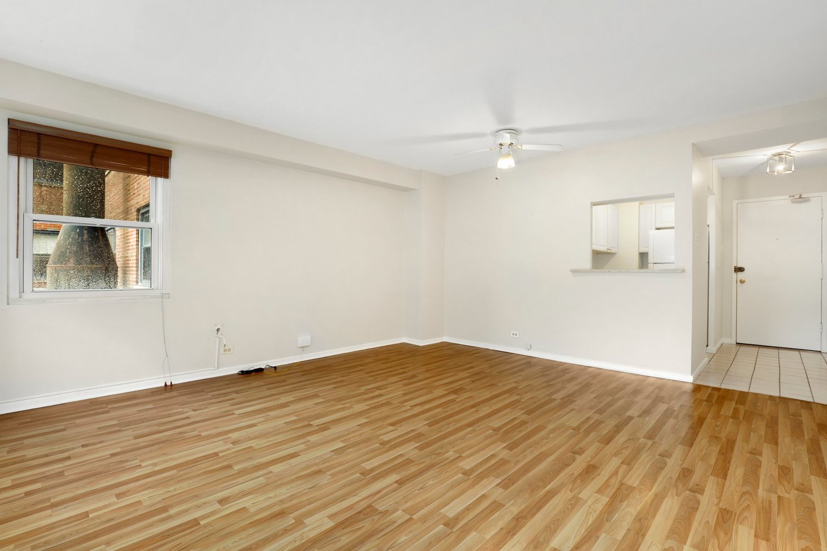 Undisclosed Address Chicago, IL 60657 - Photo 8 of 18 wooden floor in an empty room with a window