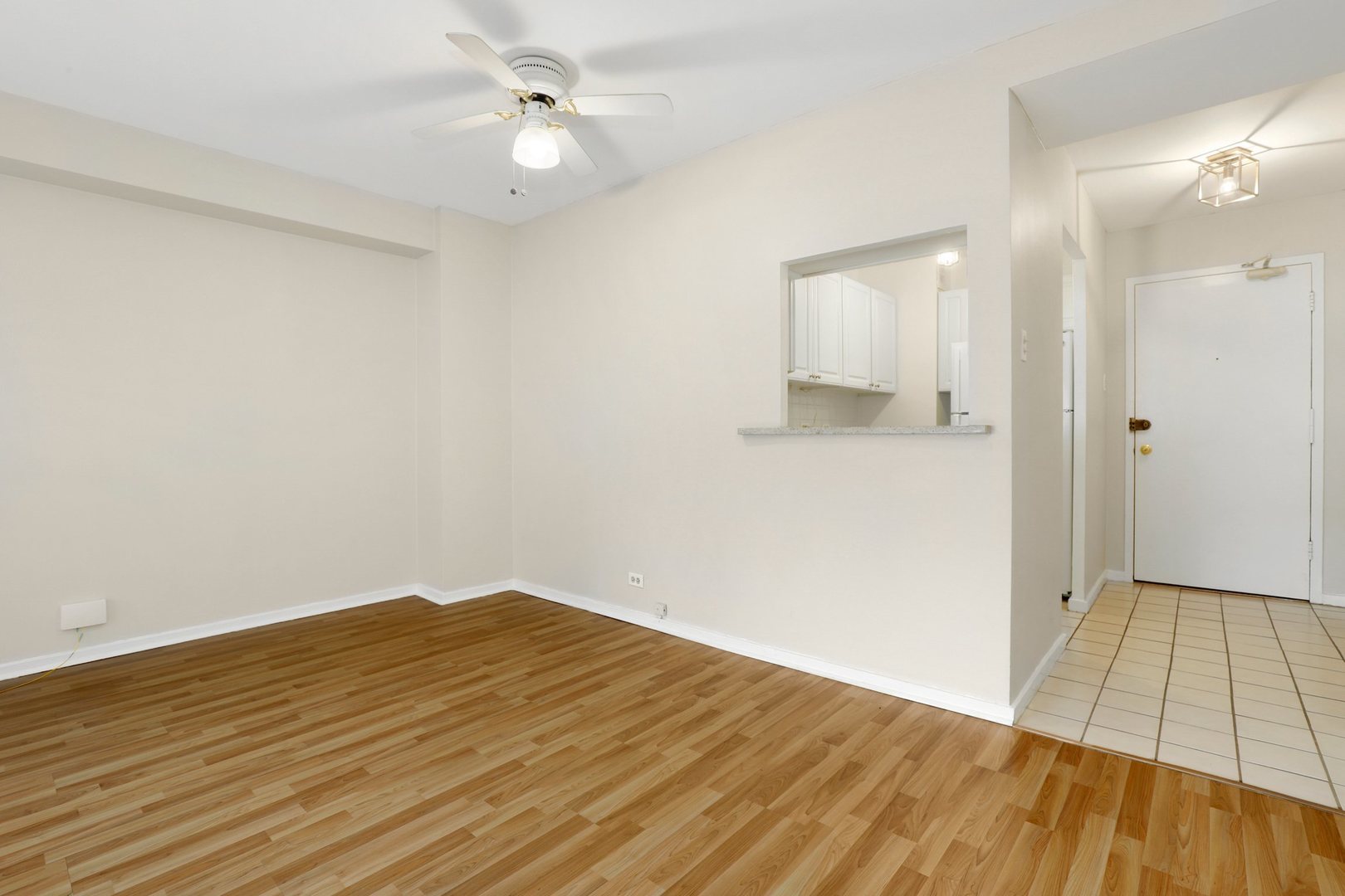 Undisclosed Address Chicago, IL 60657 - Photo 9 of 18 an empty room with wooden floor and windows