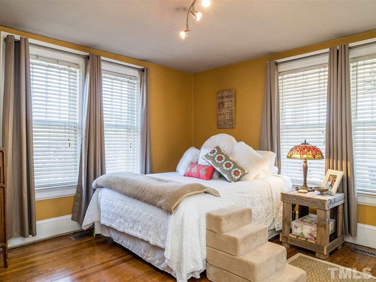 1801 Edgemont Road Wendell, NC 27591 - Photo 14 of 23 a bedroom with a bed and a window