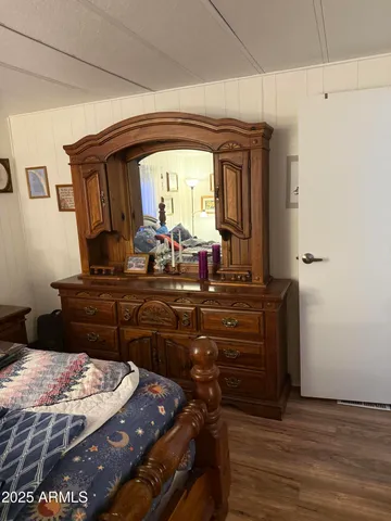 a room with a bed and a mirror