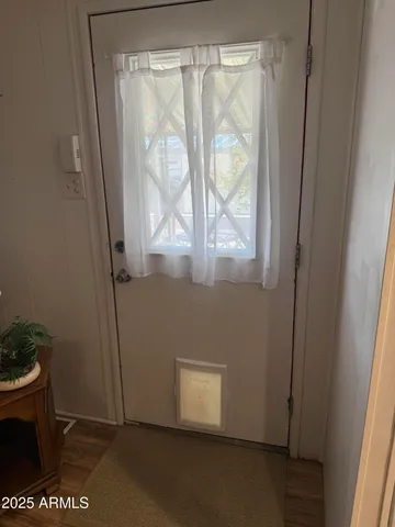 a view of an empty room with a window