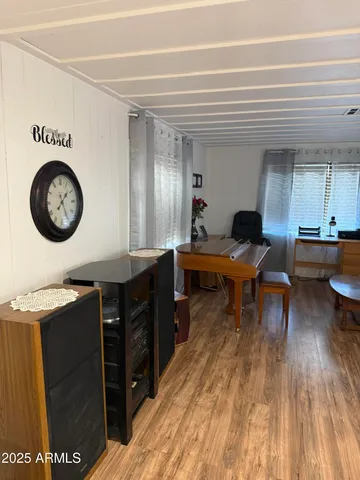 a living room with a wooden floor