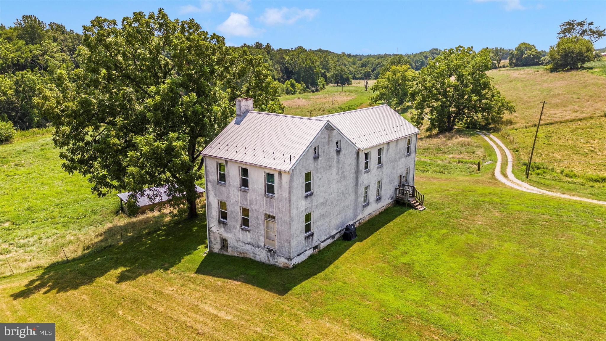 2820 Milt Summers Road Middletown, MD 21769 - Photo 11 of 88 a view of a house with a big yard and large trees