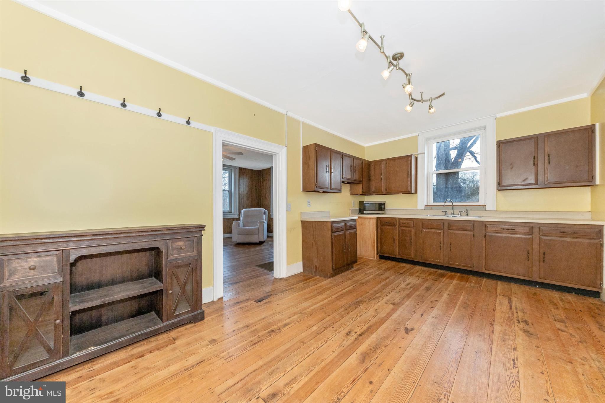 2820 Milt Summers Road Middletown, MD 21769 - Photo 29 of 88 a kitchen with granite countertop a sink cabinets and stainless steel appliances