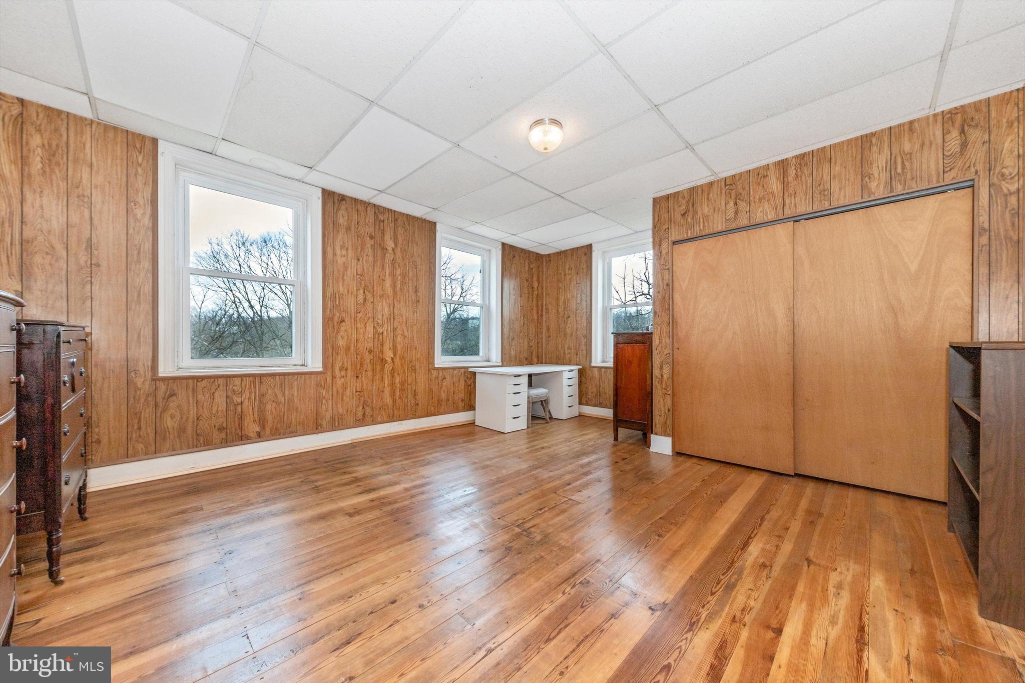 2820 Milt Summers Road Middletown, MD 21769 - Photo 35 of 88 a view of an empty room with a window and wooden floor