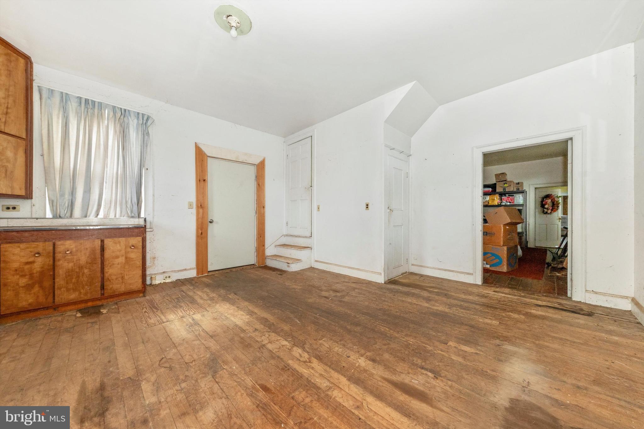 2820 Milt Summers Road Middletown, MD 21769 - Photo 49 of 88 a view of an empty room with window and wooden floor