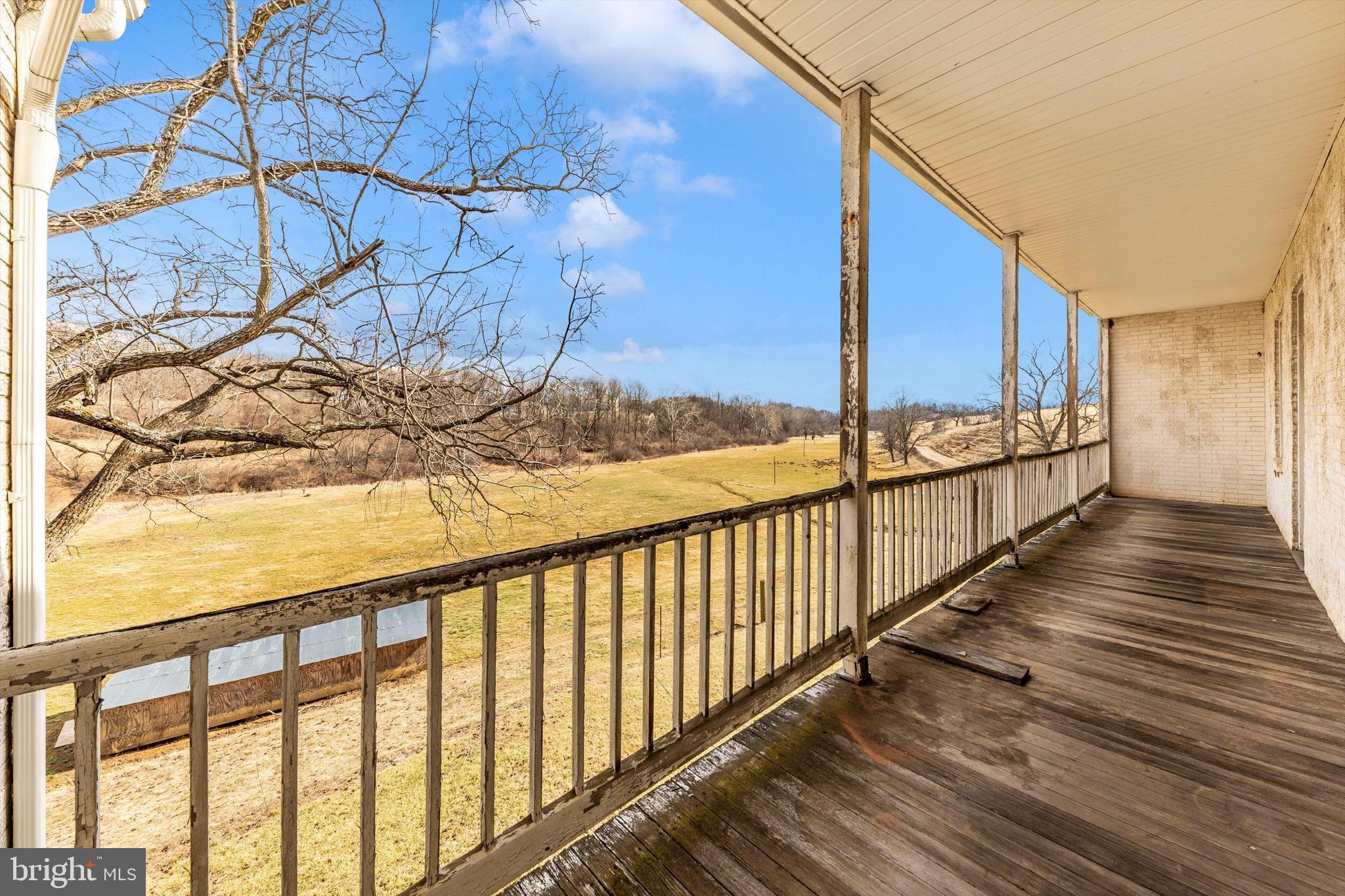 2820 Milt Summers Road Middletown, MD 21769 - Photo 52 of 88 a view of a balcony with wooden floor and fence