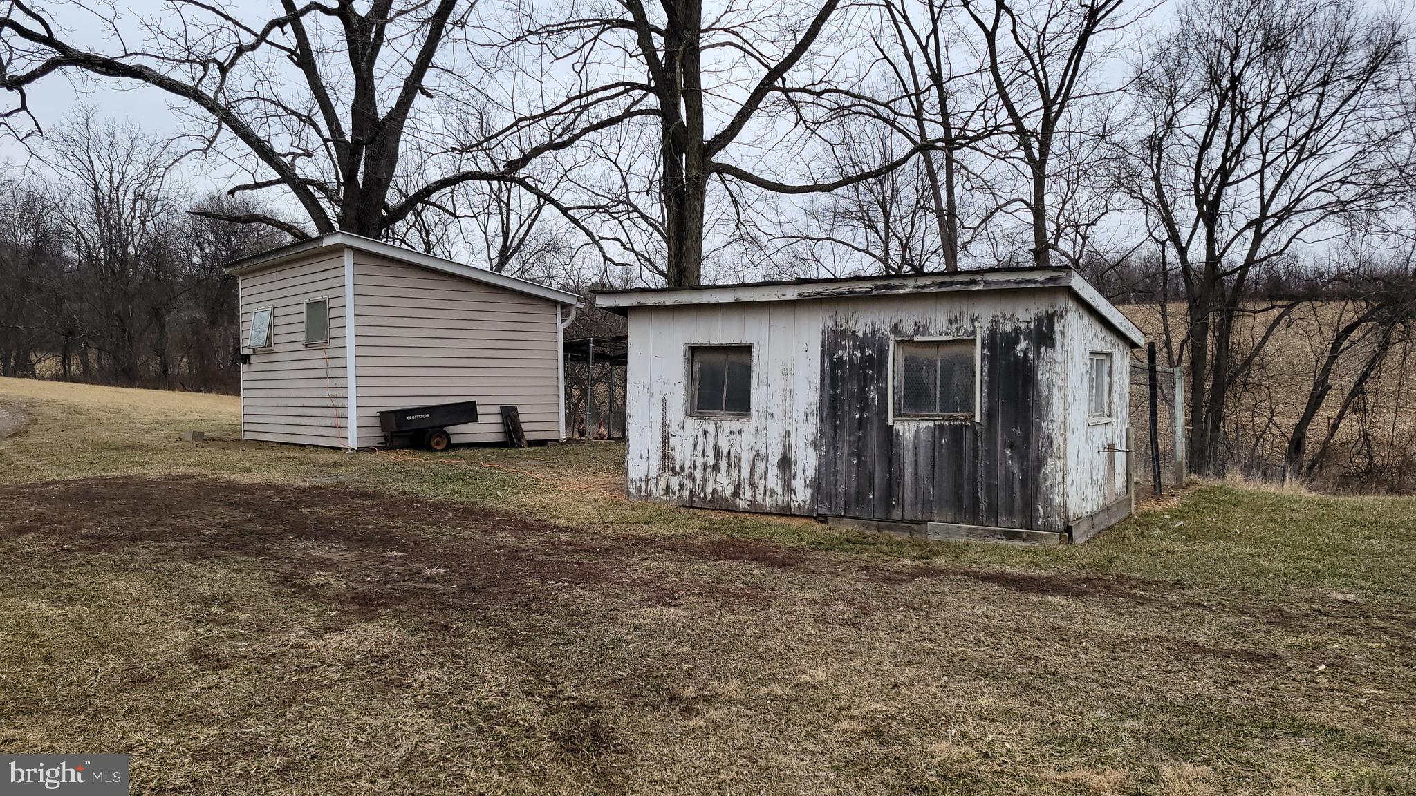 2820 Milt Summers Road Middletown, MD 21769 - Photo 58 of 88 a view of a house with a large tree and wooden fence