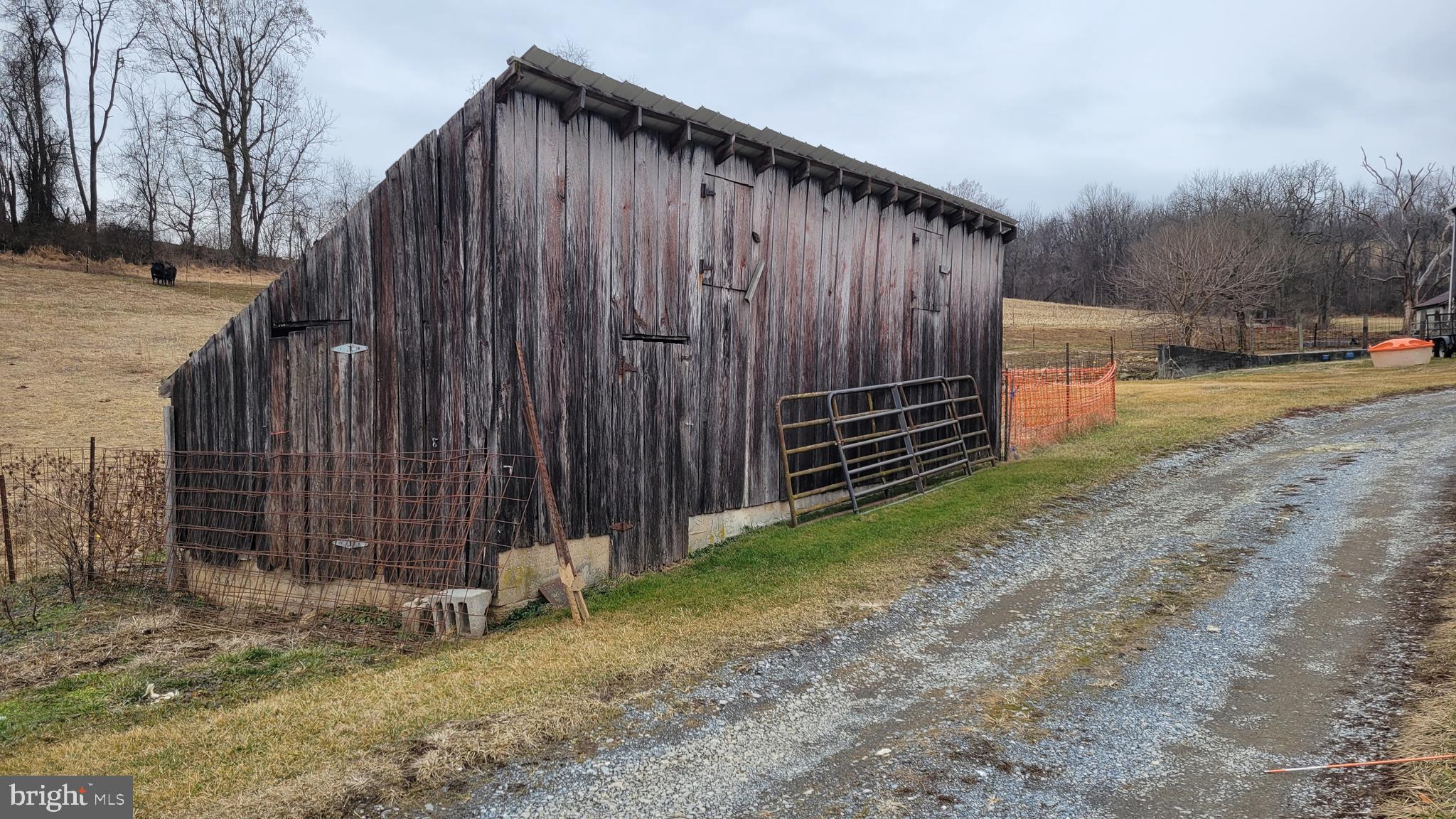 2820 Milt Summers Road Middletown, MD 21769 - Photo 61 of 88 a backyard of a house with plants and wooden fence