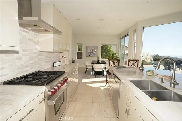 a kitchen with counter top space a sink and cabinets