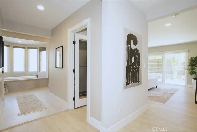 a view of an entryway with wooden floor and a rug