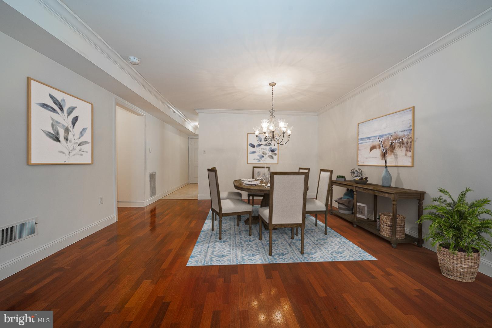 189 Valley Stream Lane Chesterbrook, PA 19087 - Photo 8 of 22 a view of a dining room with furniture a chandelier and wooden floor