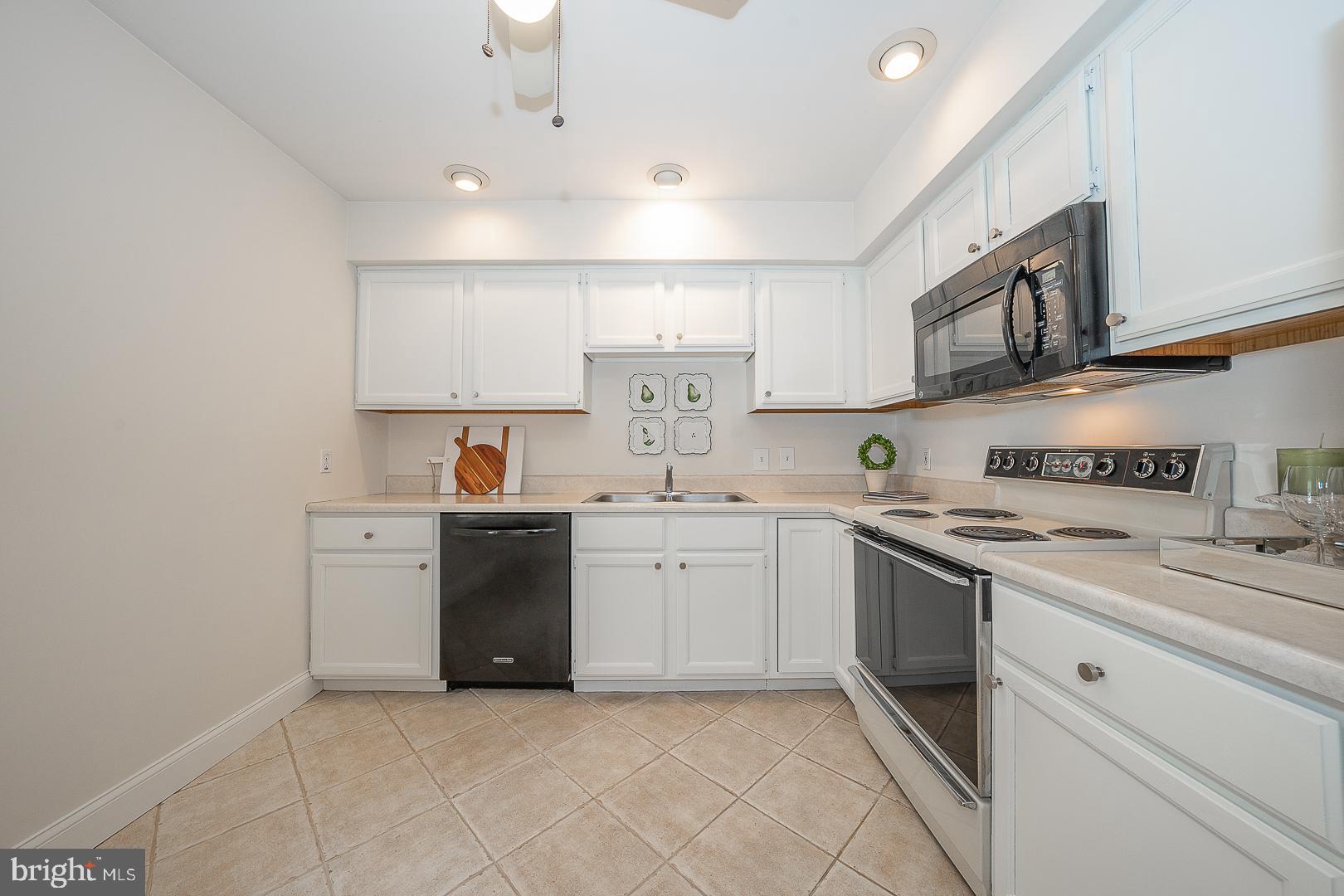 189 Valley Stream Lane Chesterbrook, PA 19087 - Photo 10 of 22 a kitchen with stainless steel appliances granite countertop a sink and cabinets
