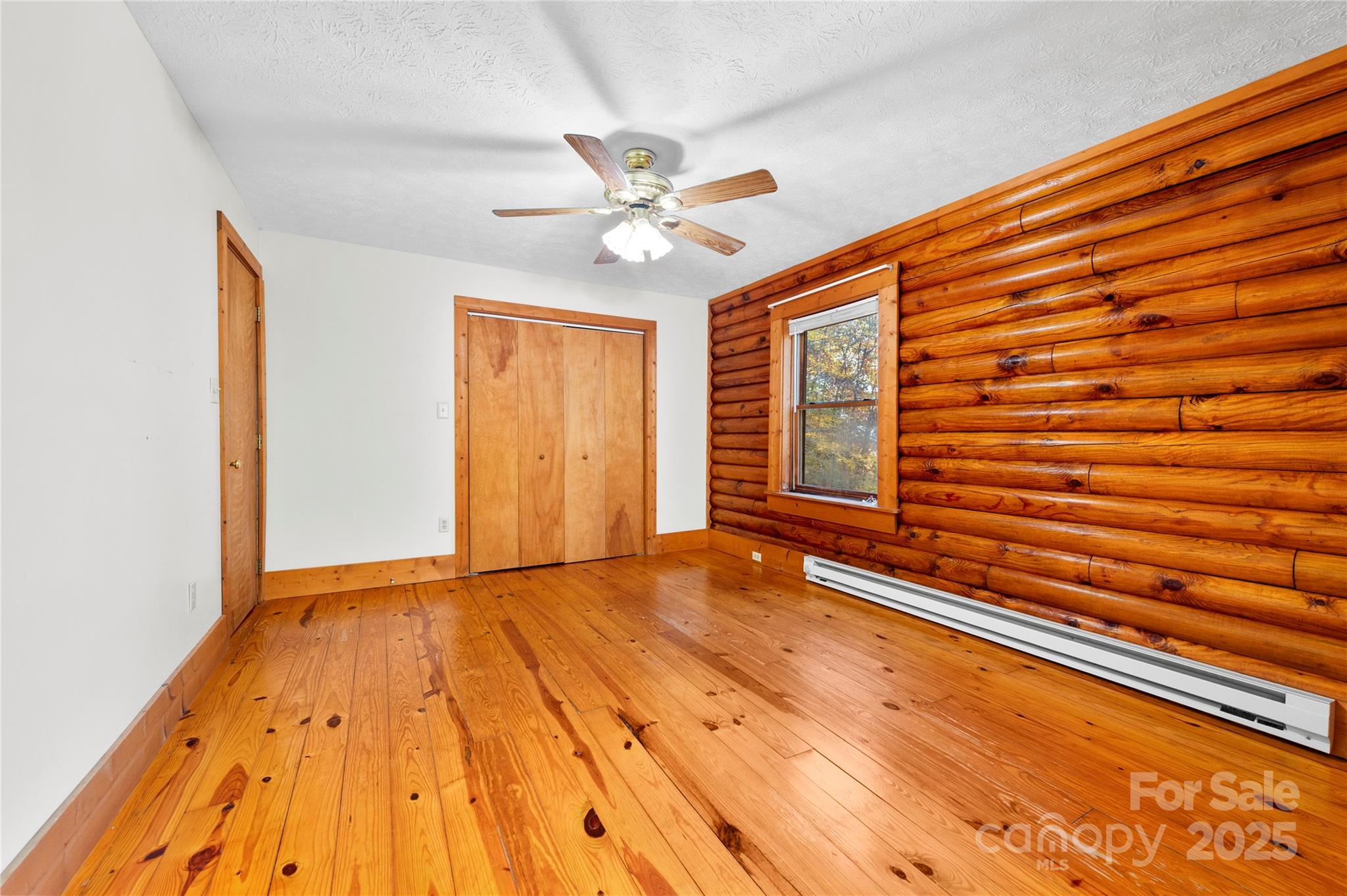 5 Rustic Rdg Drive Candler, NC 28715 - Photo 13 of 17 a view of an empty room with window and wooden floor
