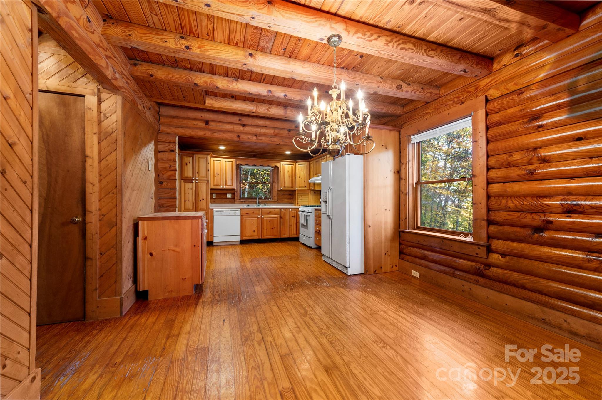 5 Rustic Rdg Drive Candler, NC 28715 - Photo 8 of 17 a view of a hallway with wooden floor and a kitchen