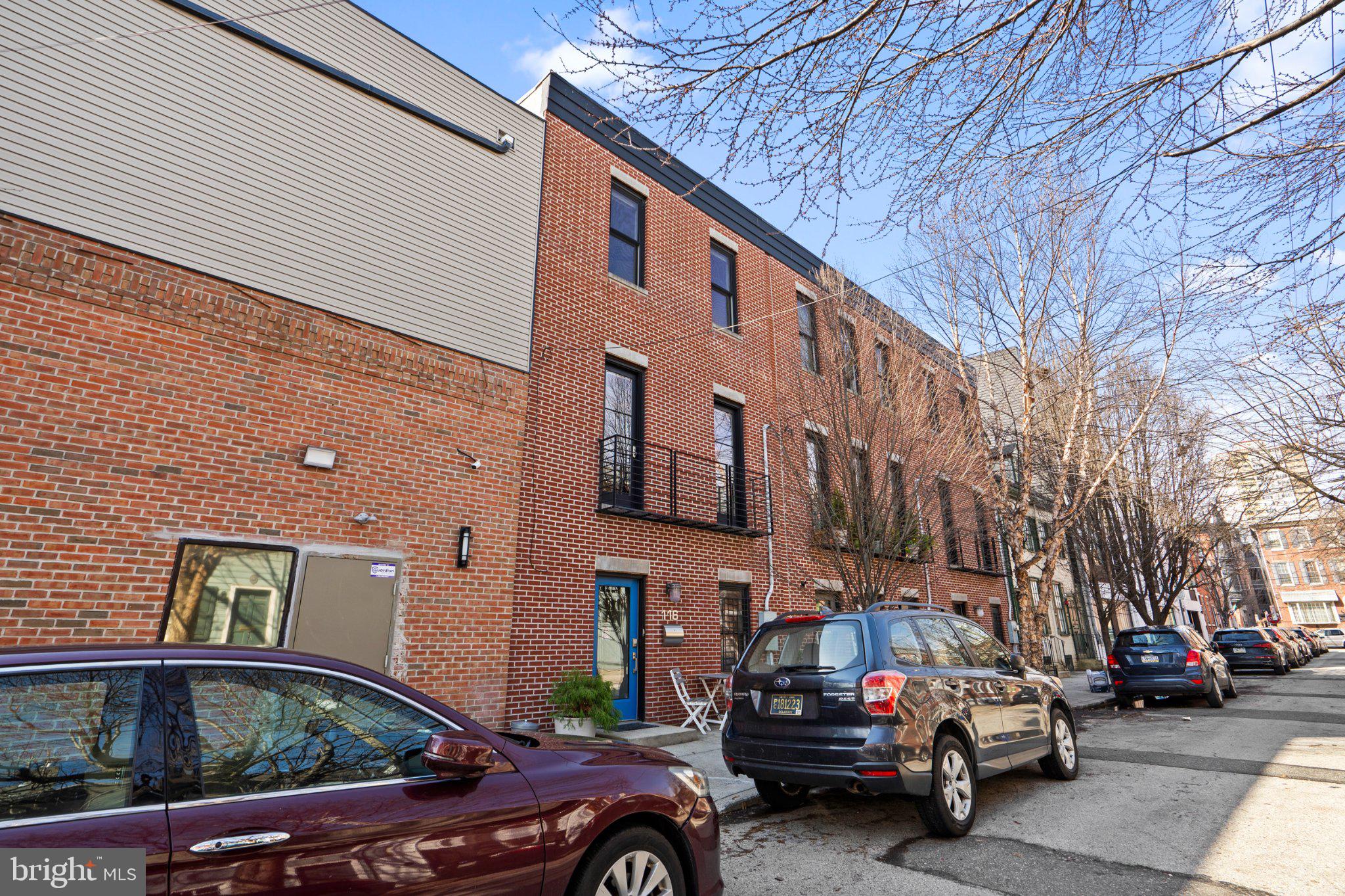 Charming urban brick facade awaits.