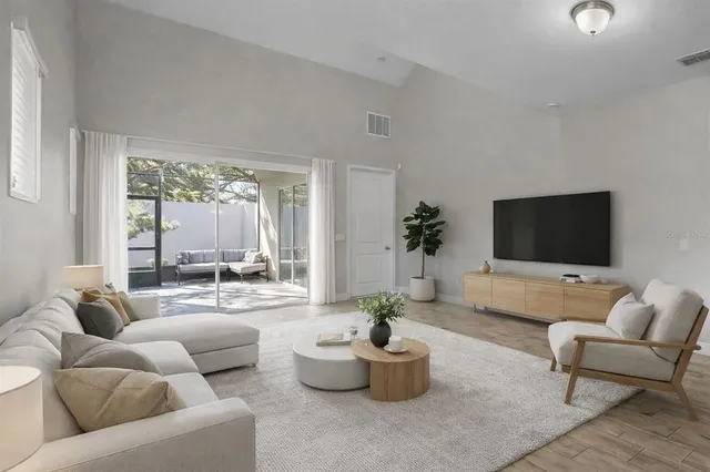 a spacious bathroom with a granite countertop sink mirror and a shower
