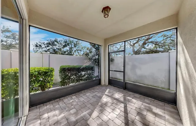 a bathroom with a granite countertop sink a toilet and a mirror