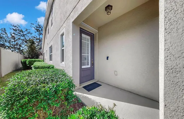 a kitchen with stainless steel appliances sink refrigerator and wooden floor
