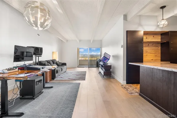 a view of a kitchen with furniture and a flat screen tv