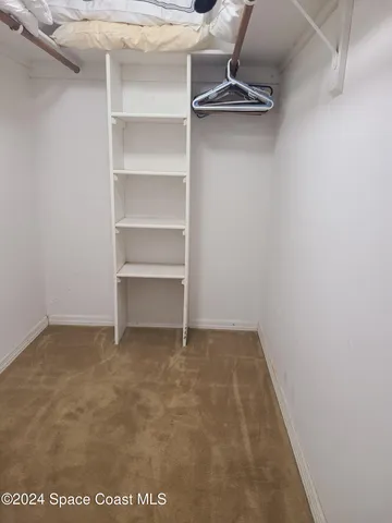 a bathroom with a sink vanity and a mirror