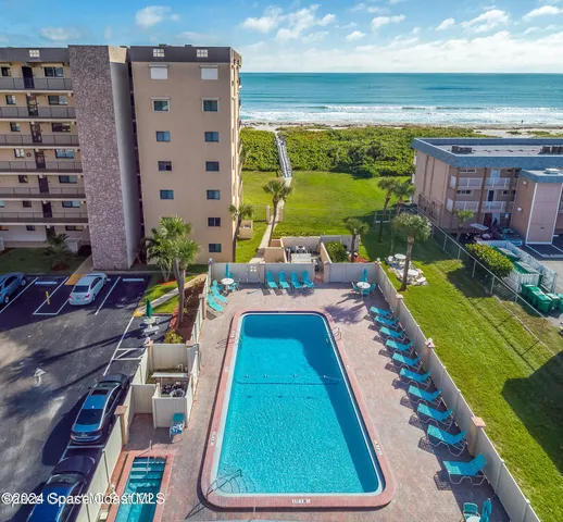 a view of swimming pool from a balcony
