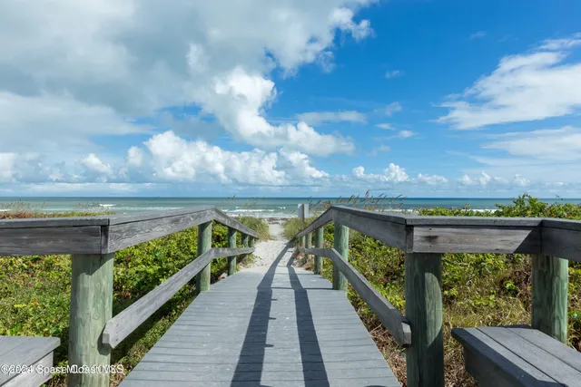 a view of balcony and floor to ceiling window