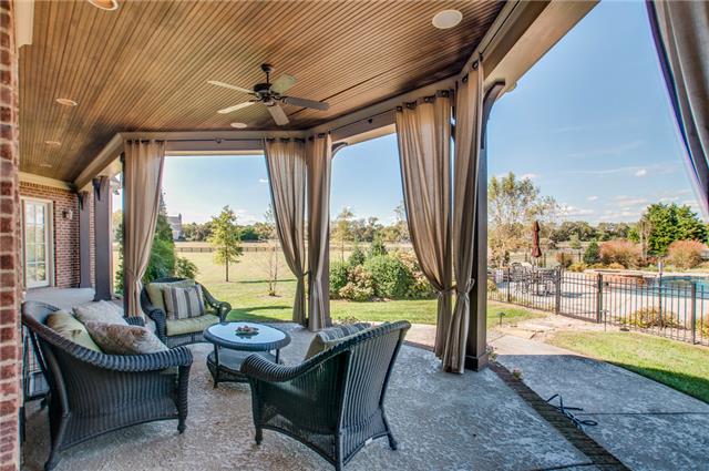 4219 Two Rivers Lane Franklin, TN 37069 - Photo 17 of 20 a outdoor space with patio couch and wooden floor