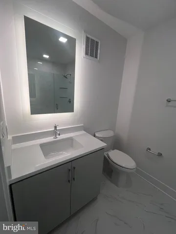 a view of a balcony with outdoor seating