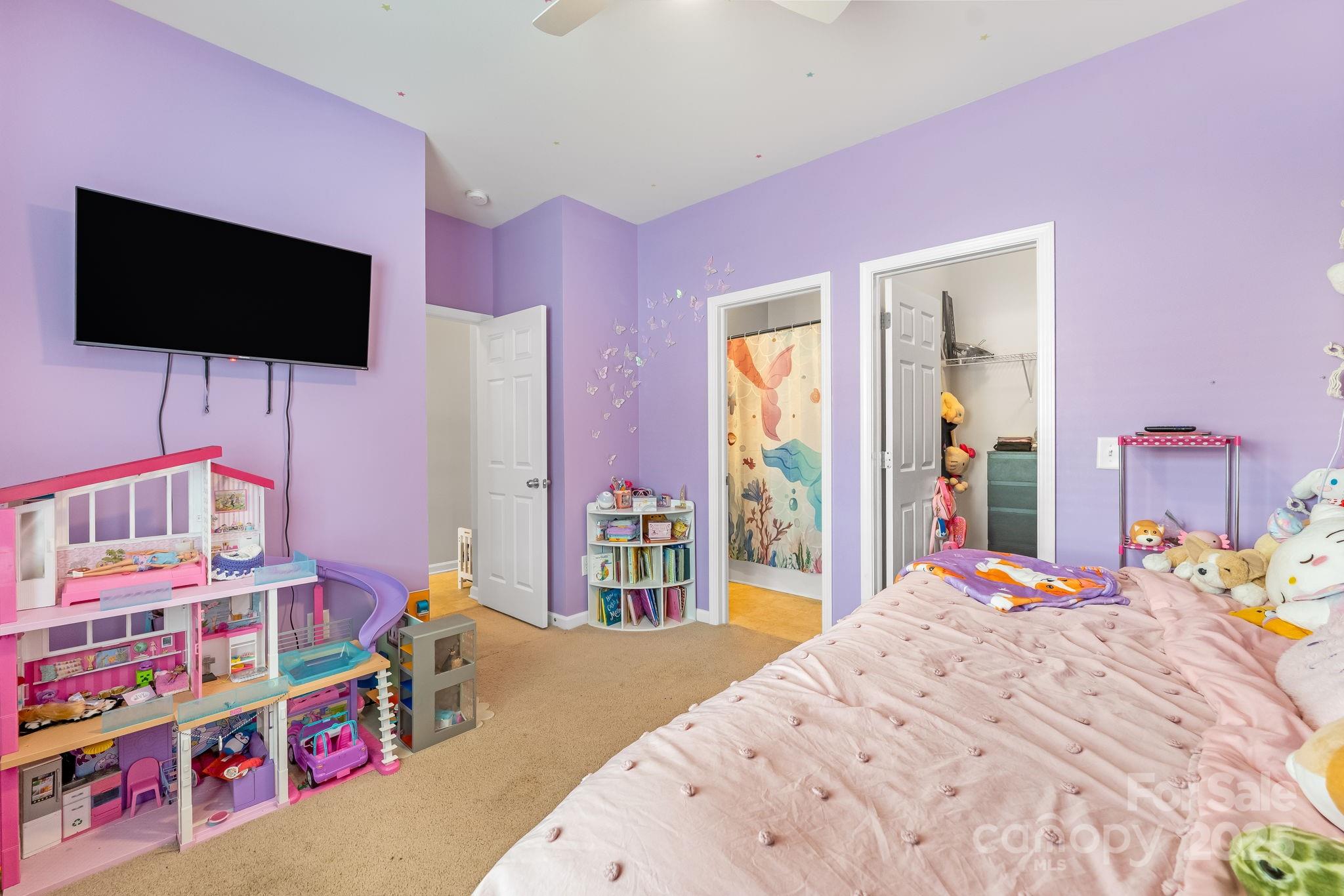 4246 Lotts Place Rock Hill, SC 29732 - Photo 17 of 24 a bedroom with a bed and a flat screen tv