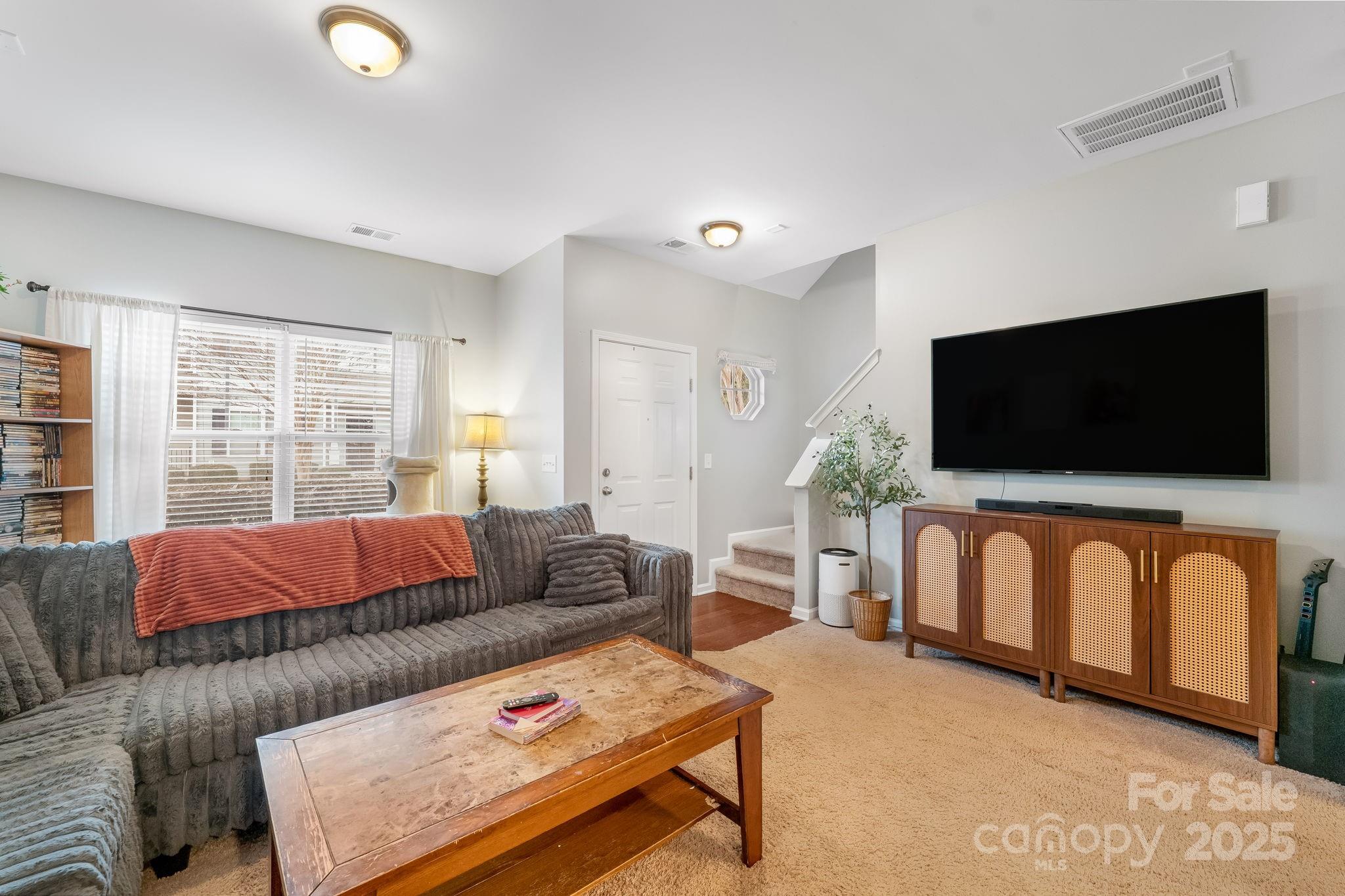 4246 Lotts Place Rock Hill, SC 29732 - Photo 4 of 24 a living room with furniture and a flat screen tv