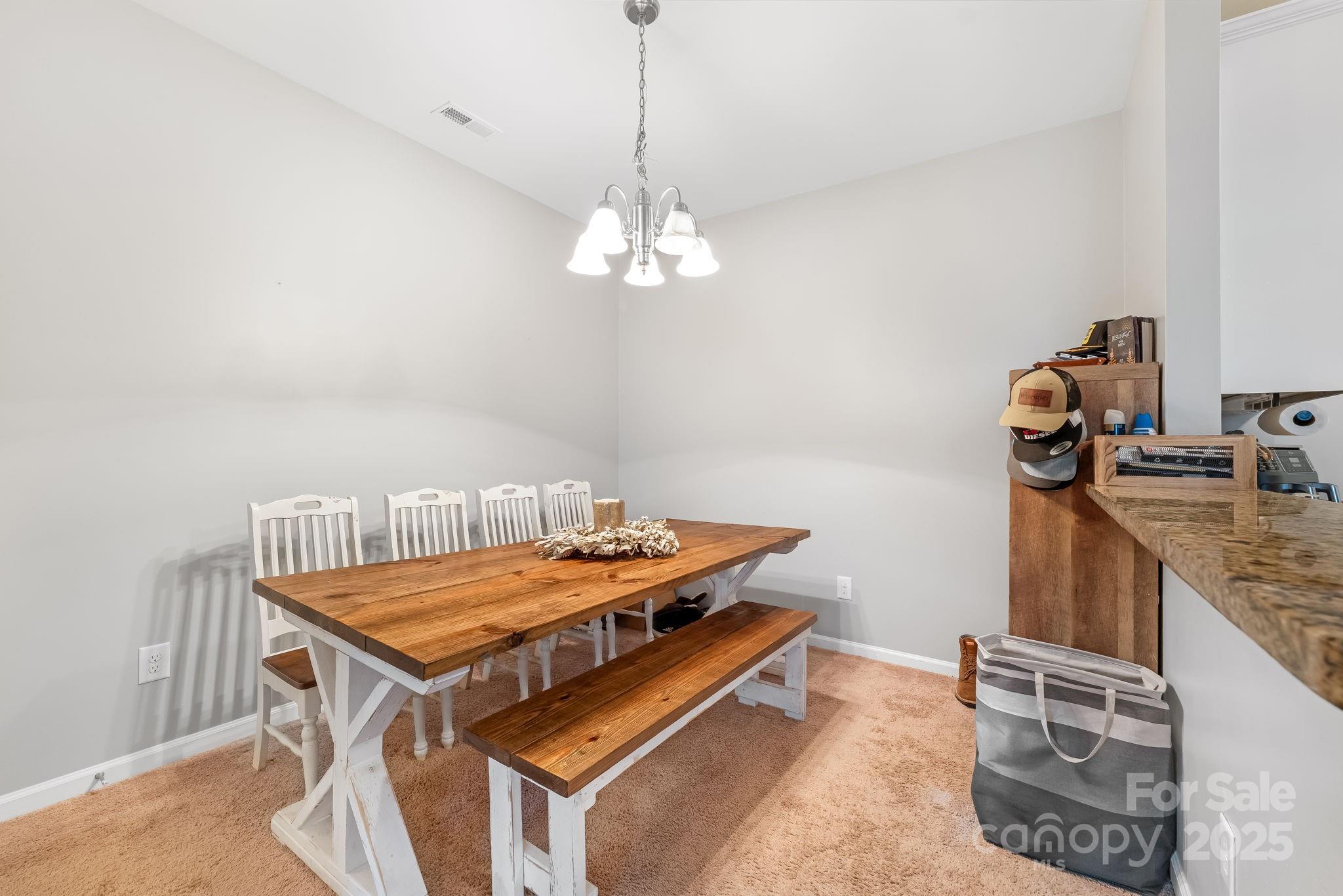4246 Lotts Place Rock Hill, SC 29732 - Photo 6 of 24 a dining room with a table and chairs