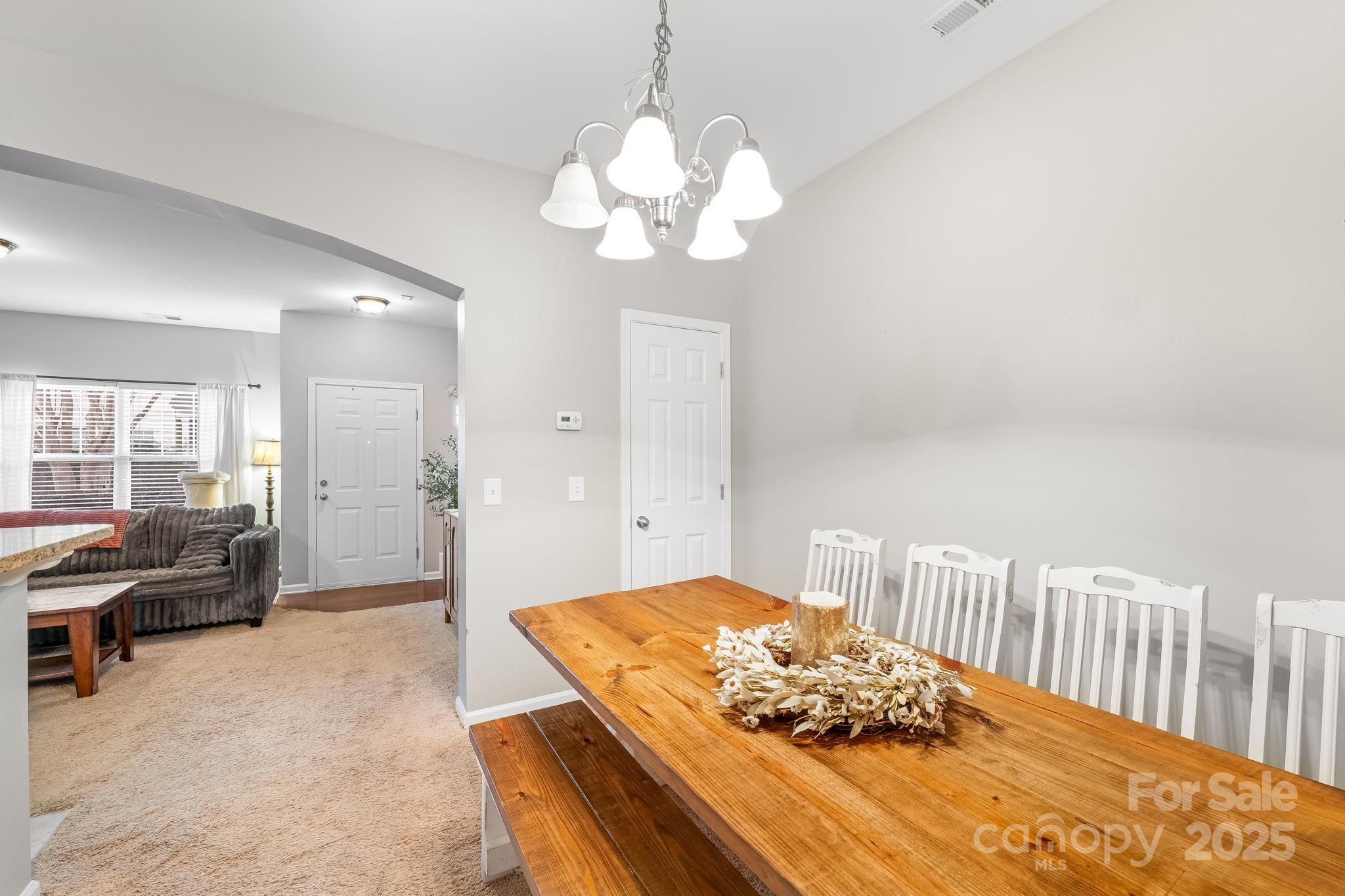 4246 Lotts Place Rock Hill, SC 29732 - Photo 7 of 24 a living room with furniture chandelier and a large window