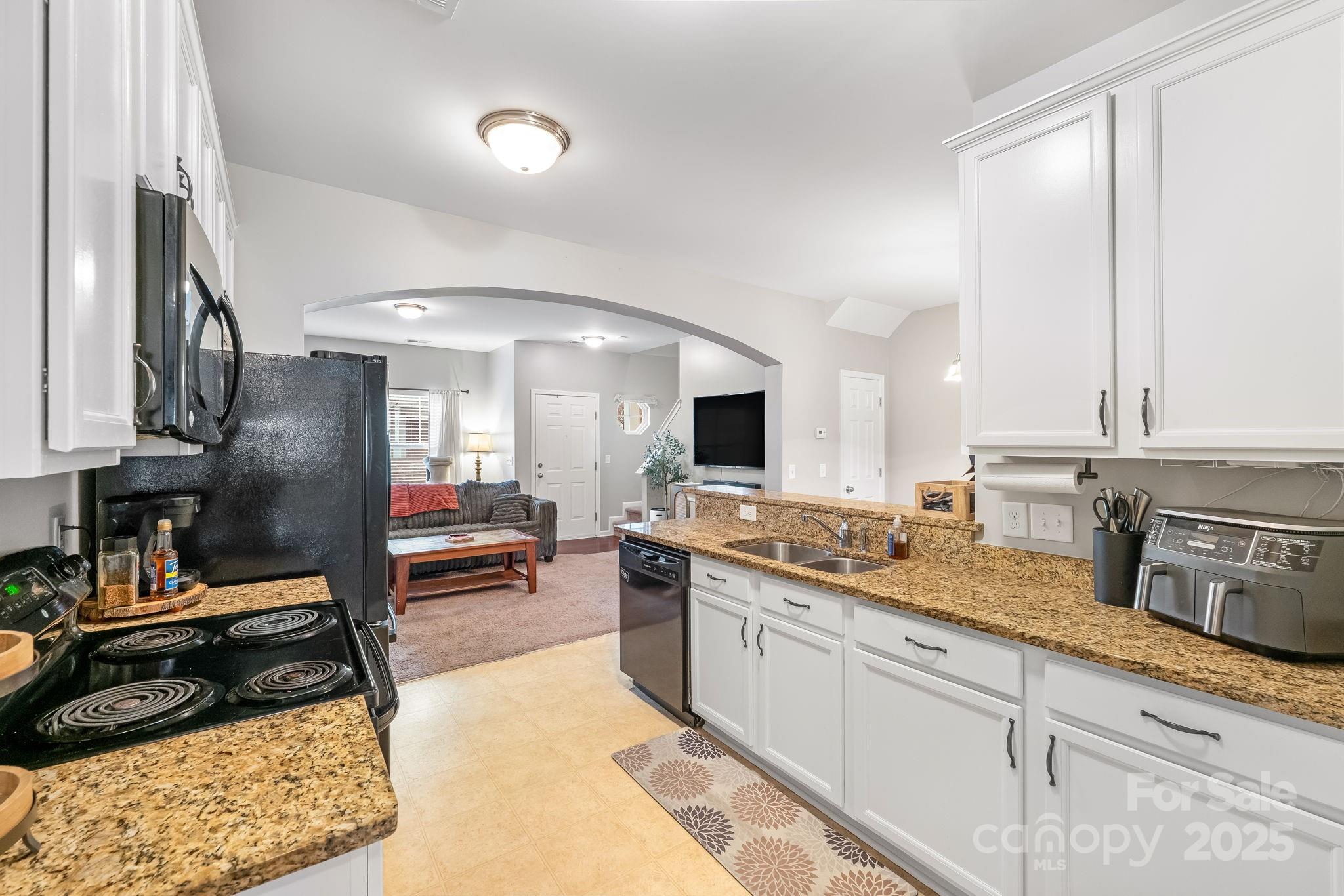 4246 Lotts Place Rock Hill, SC 29732 - Photo 10 of 24 a kitchen with a sink stove and cabinets