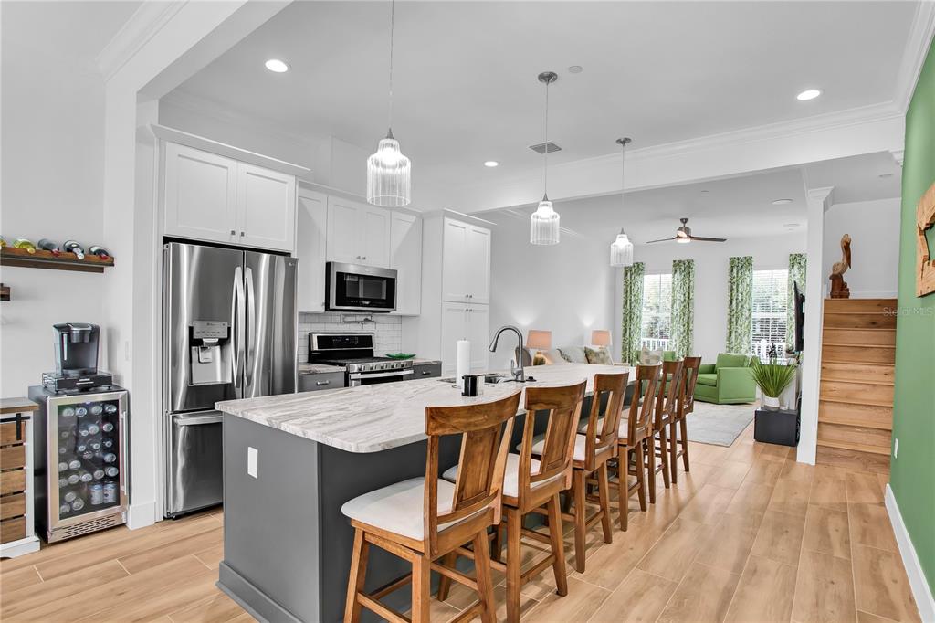 19915 Gulf Boulevard, Unit 204 Indian Rocks Beach, FL 33785 - Photo 12 of 47 a large kitchen with a table and chairs