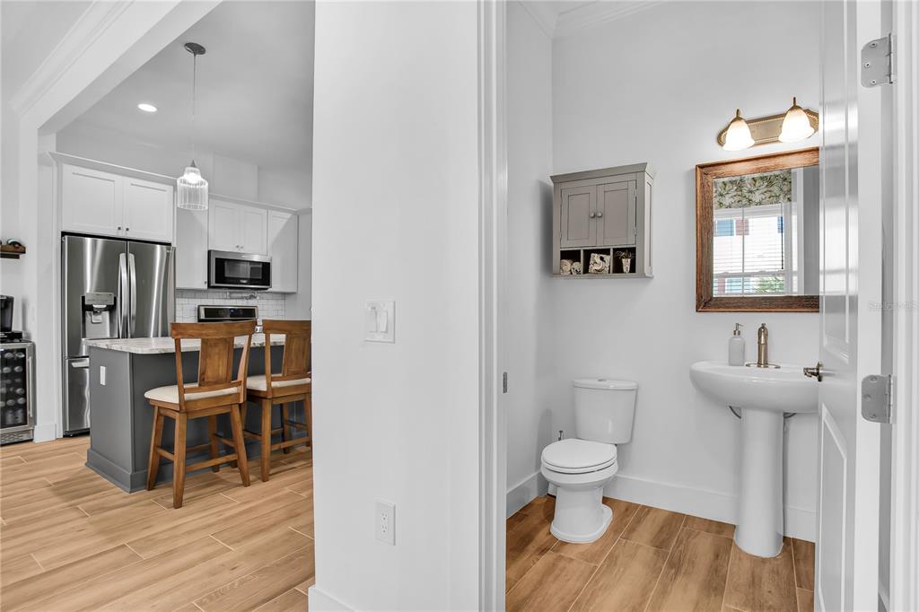 19915 Gulf Boulevard, Unit 204 Indian Rocks Beach, FL 33785 - Photo 19 of 47 a bathroom with a sink a toilet and a view of bathroom