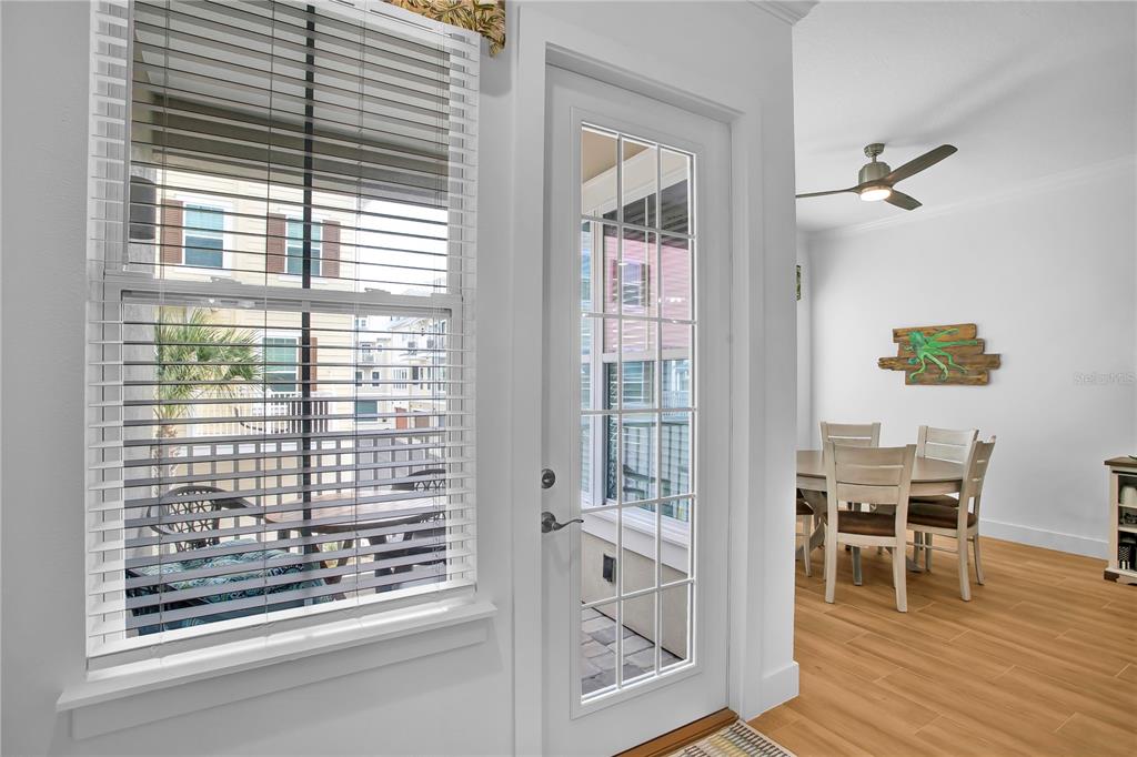 19915 Gulf Boulevard, Unit 204 Indian Rocks Beach, FL 33785 - Photo 20 of 47 a view of a dining room with furniture and wooden floor