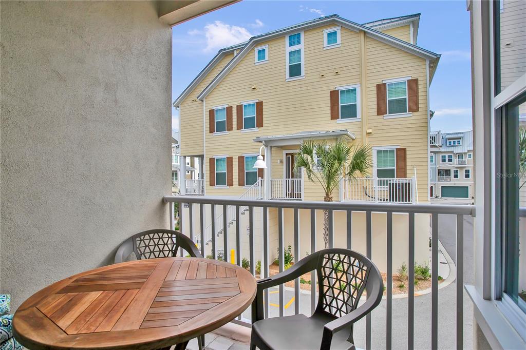 19915 Gulf Boulevard, Unit 204 Indian Rocks Beach, FL 33785 - Photo 21 of 47 a front view of a house with a chairs