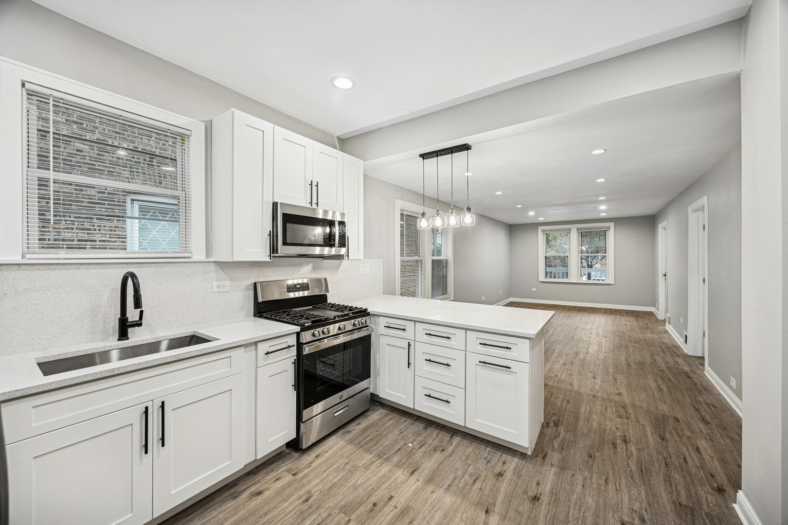 5533 West 63rd Place Chicago, IL 60638 - Photo 2 of 20 a kitchen with stainless steel appliances granite countertop a stove and a sink