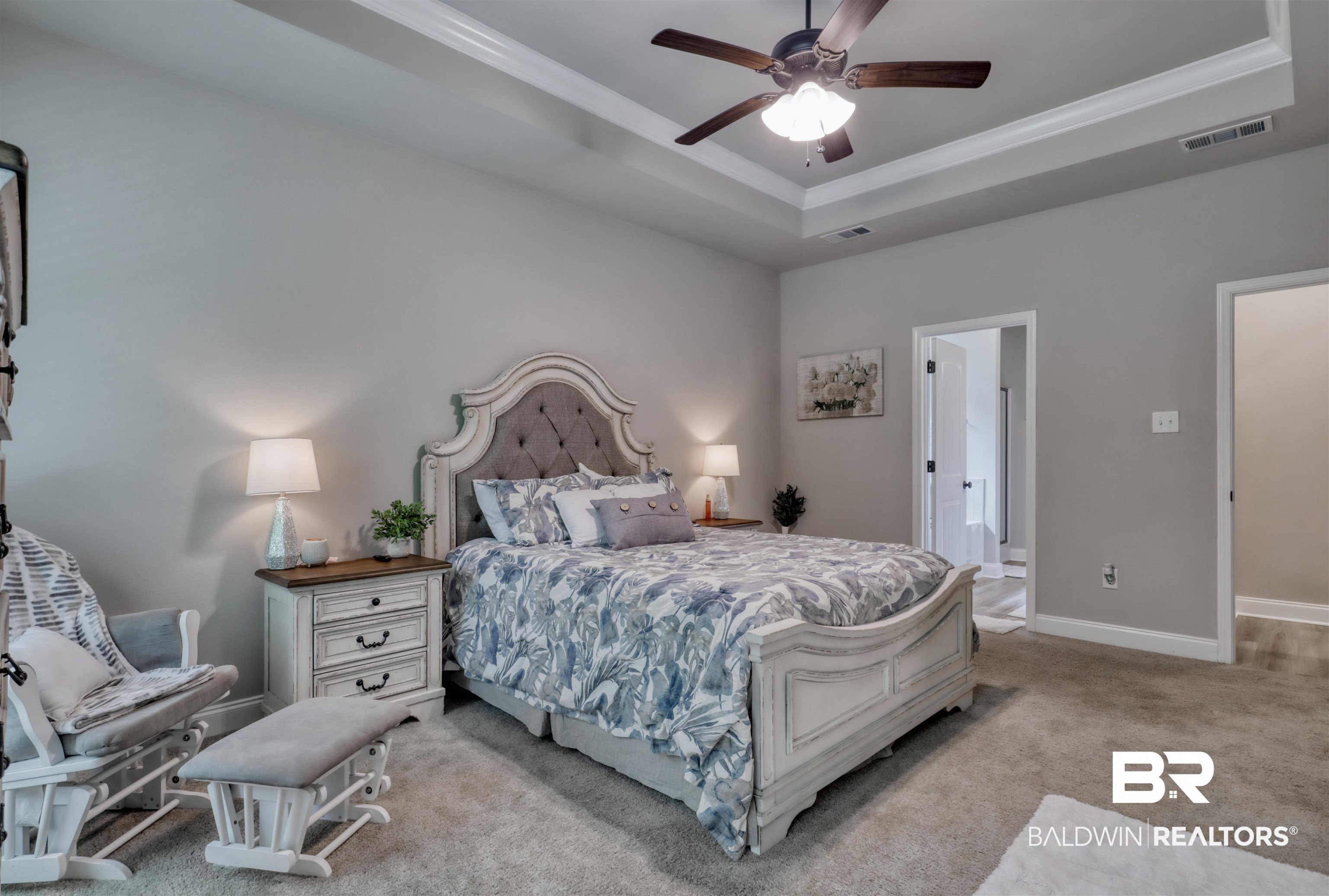 987 Gibson Court Foley, AL 36535 - Photo 16 of 34 Bedroom with visible vents, ornamental molding, a raised ceiling, and carpet