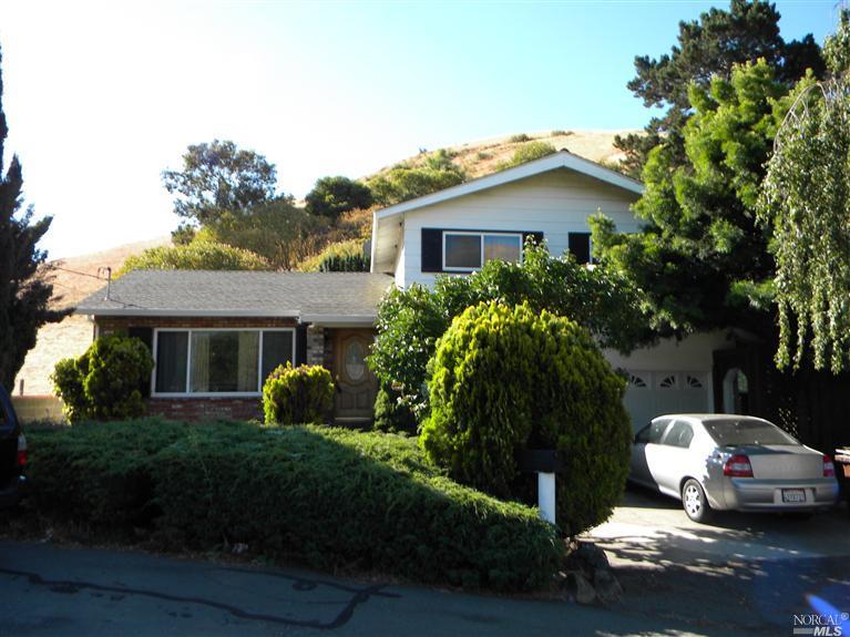 181 Old County Road Crockett, CA 94525 - Photo 1 of 1 a front view of a house with garden