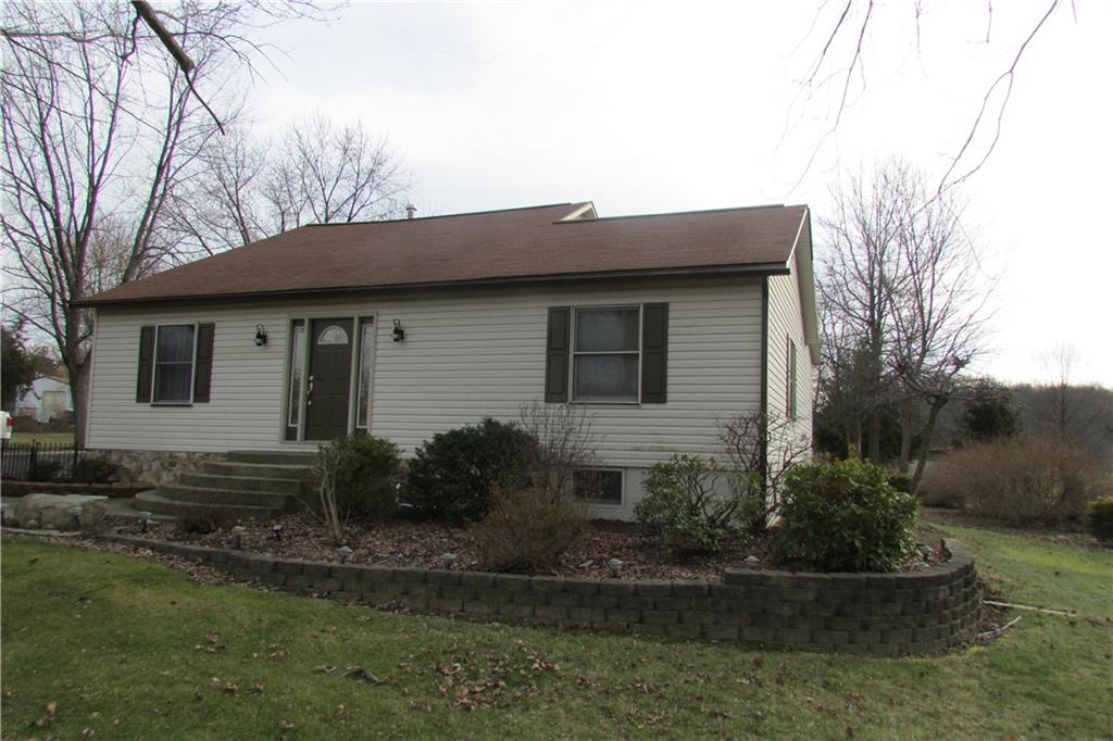 3110 Mercer Road New Castle, PA 16105 - Photo 1 of 25 Exterior of front of house with manicured landscaping.