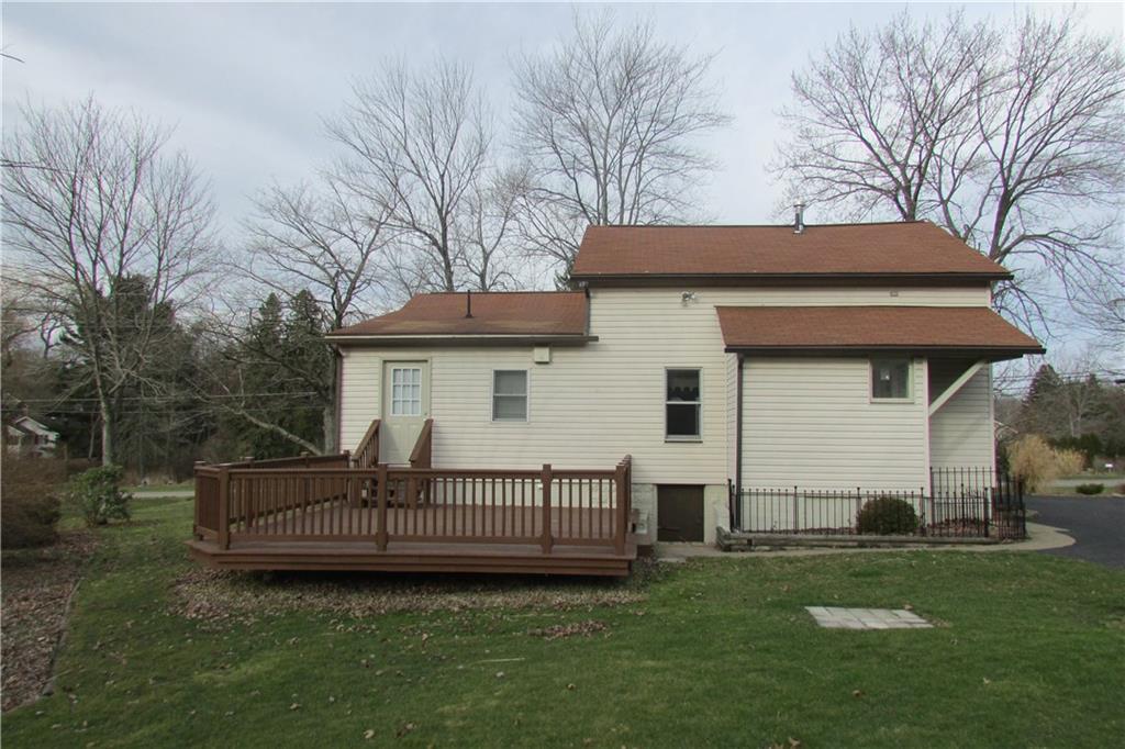 3110 Mercer Road New Castle, PA 16105 - Photo 2 of 25 Rear exterior of house with large deck and one acre invisible fence for your dog.