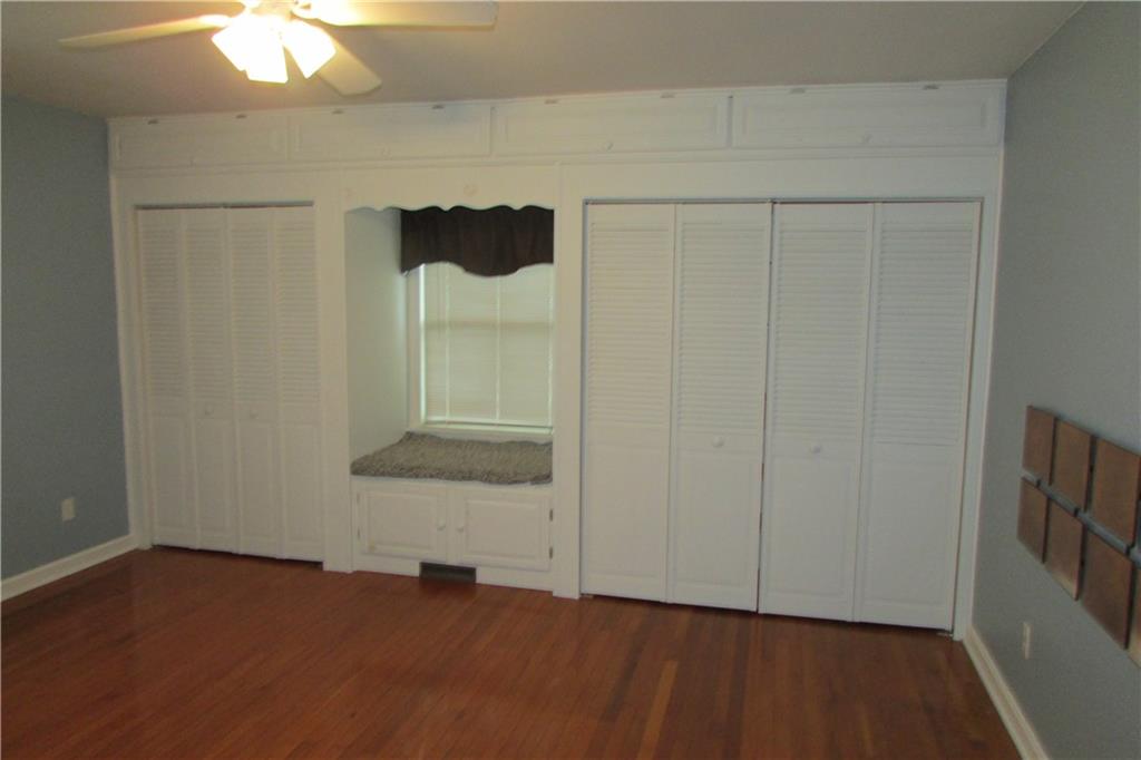 3110 Mercer Road New Castle, PA 16105 - Photo 11 of 25 Master bedroom with California closets. Great window seat with storage for blankets. Overhead cupboards makes full use of this wall.