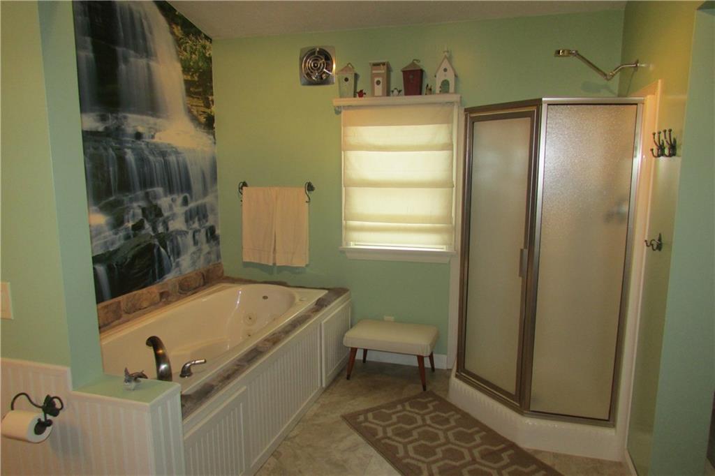 3110 Mercer Road New Castle, PA 16105 - Photo 14 of 25 Great bathroom with Jetta tub and free standing shower. Waterfall mural is a relaxing scene while enjoying your bath.