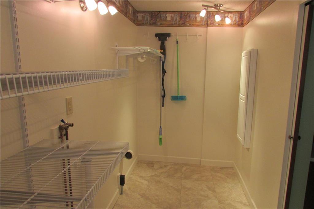 3110 Mercer Road New Castle, PA 16105 - Photo 21 of 25 Main floor laundry room with washer and dryer hookups. On the wall ironing board.