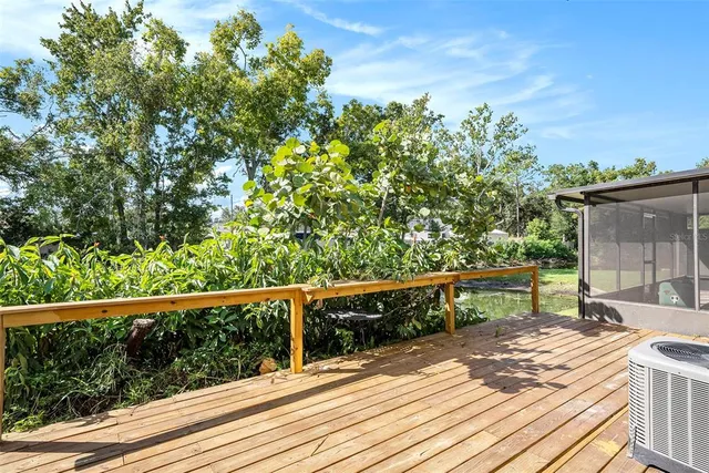 a view of balcony with wooden floor and seating space