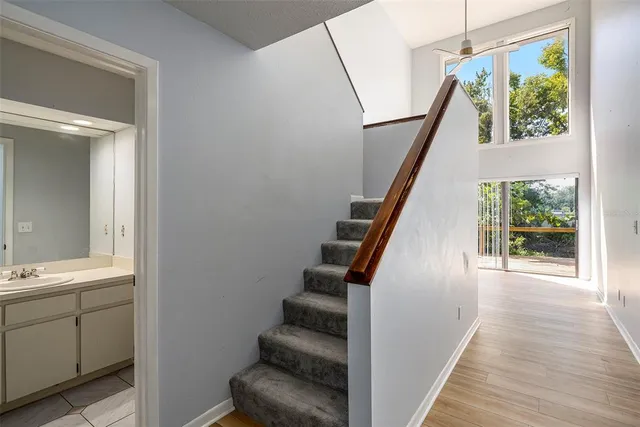 a view of entryway and hall with wooden floor