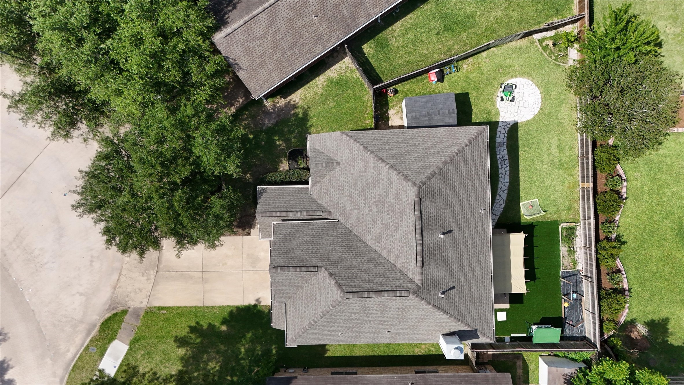 10054 Rio Bravo Road Houston, TX 77064 - Photo 7 of 41 Aerial Photo of the home showcasing the new roof and the backyard